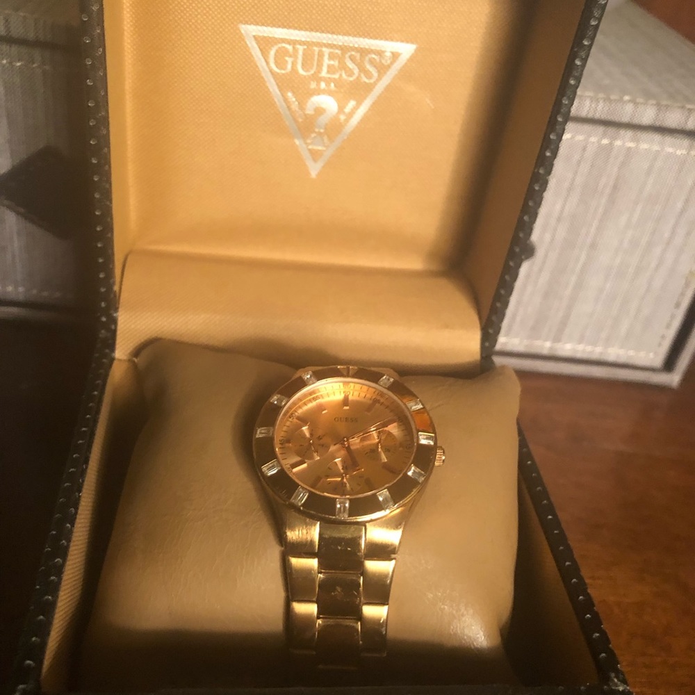 Guess gold tone watch.